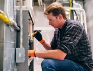 Furnace Technician doing Repair